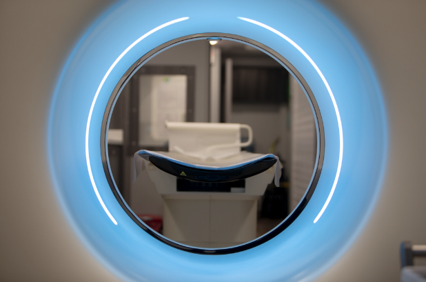 View of a PET scan patient exam table from inside a PET Scan machine.